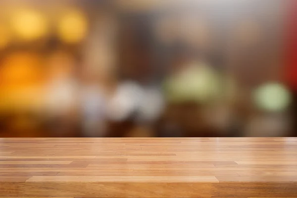 Mesa de madera vacía y fondo borroso café — Foto de Stock