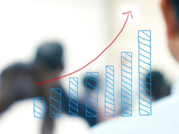 Growth bar chart with blurred business people background — Stock Photo, Image