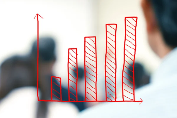 Growth bar chart with blurred business people background — Stock Photo, Image