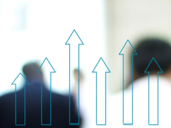 Growth arrow chart with blurred business people background — Stock Photo, Image