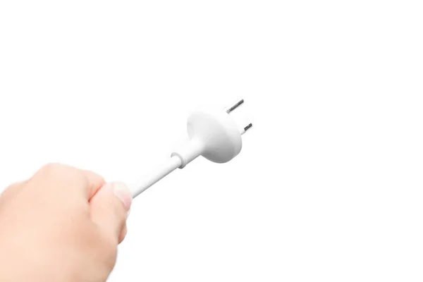 Hand holds Electric plug. Isolated on a white background. — Stock Photo, Image