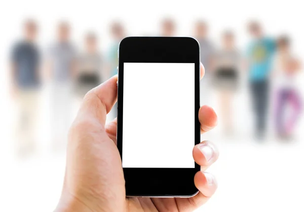 Hand holding phone on people background — Stock Photo, Image