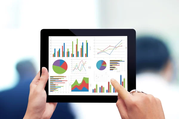 Hand holding digital tablet with analyzing graph — Stock Photo, Image