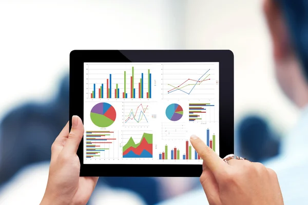 Hand holding digital tablet with analyzing graph — Stock Photo, Image