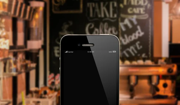 Chiudere smart phone contro bella cucina sfondo — Foto Stock