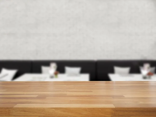 Empty wooden table and blurred modern restaurant background — Stock Photo, Image