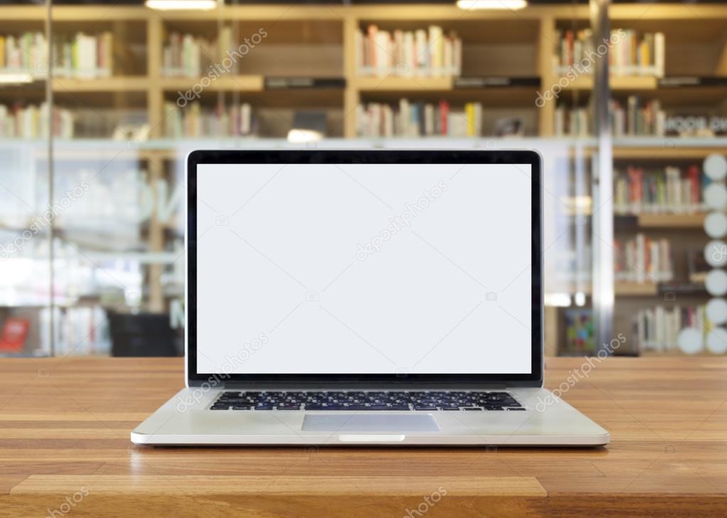 Laptop on table, on bookshelf background,blank screen