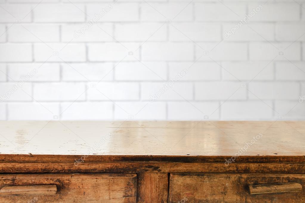 Empty table and white brick wall background