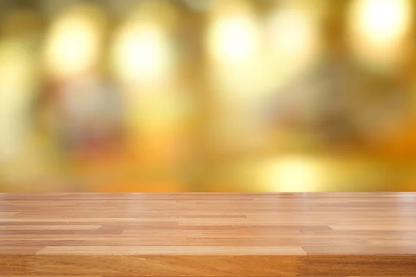 Empty wooden table and blurred cafe background — Stock Photo, Image