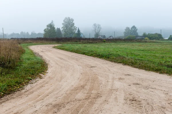 Strada vuota in campagna in autunno — Foto Stock