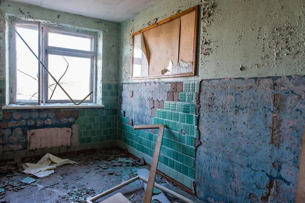 Abandoned interior in ruins of military settlement — Stock Photo, Image