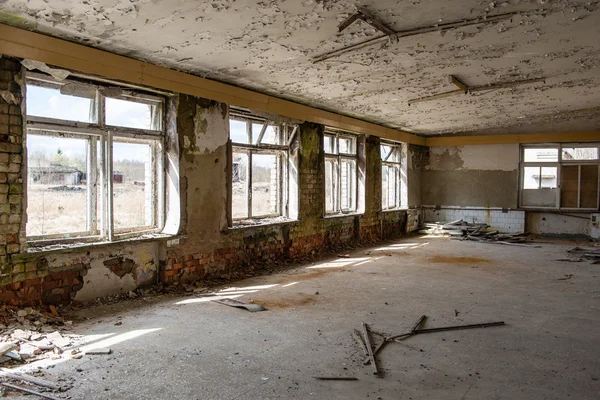 Abandoned interior in ruins of military settlement — Stock Photo, Image