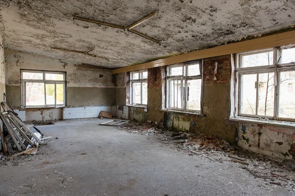 Abandoned interior in ruins of military settlement — Stock Photo, Image