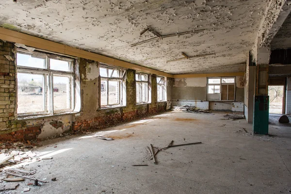 Abandoned interior in ruins of military settlement — Stock Photo, Image