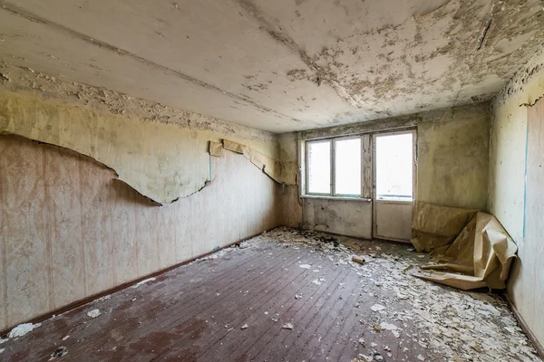 Abandoned interior in ruins of military settlement — Stock Photo, Image