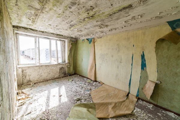 Abandoned interior in ruins of military settlement — Stock Photo, Image