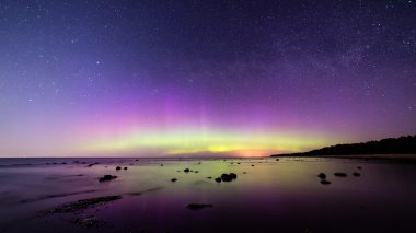 Intense northern lights (Aurora borealis) over Baltic sea clipart