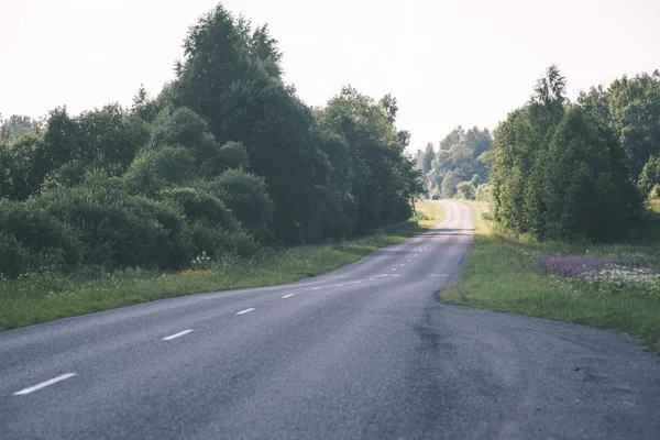 Simple country road in summer - vintage film effect — Stock Photo, Image