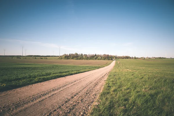 Simple country road in summer - vintage film effect — Stock Photo, Image