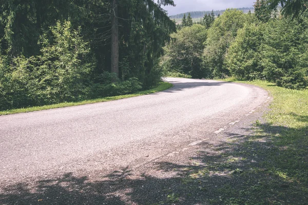 Mountain country road in summer - vintage film effect — Stock Photo, Image