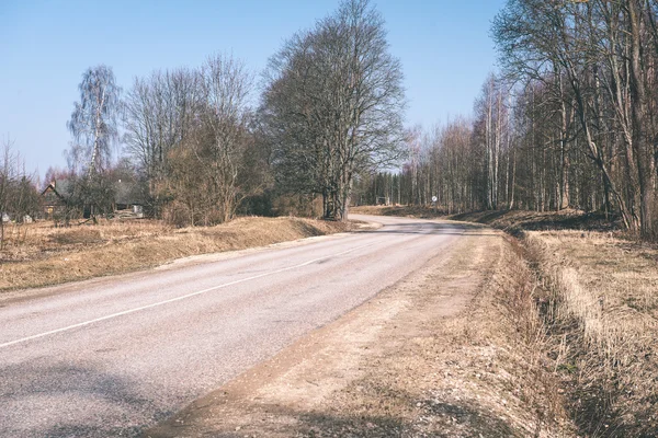 Simple country road in summer - vintage film effect — Stock Photo, Image