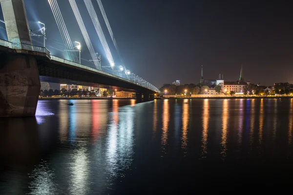 Summer night city light reflections over water — Stock Photo, Image