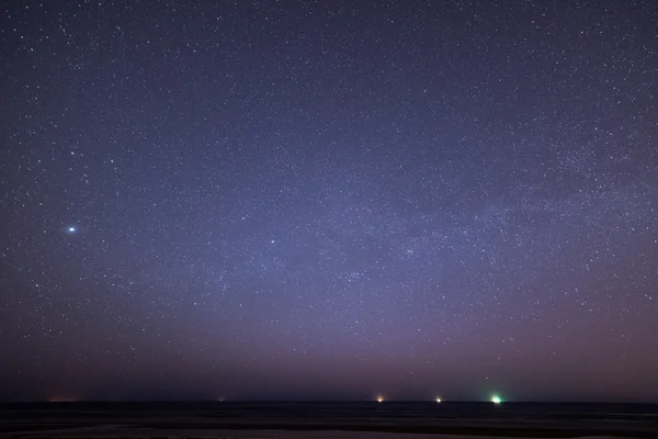 night sky with stars on the beach. space view.