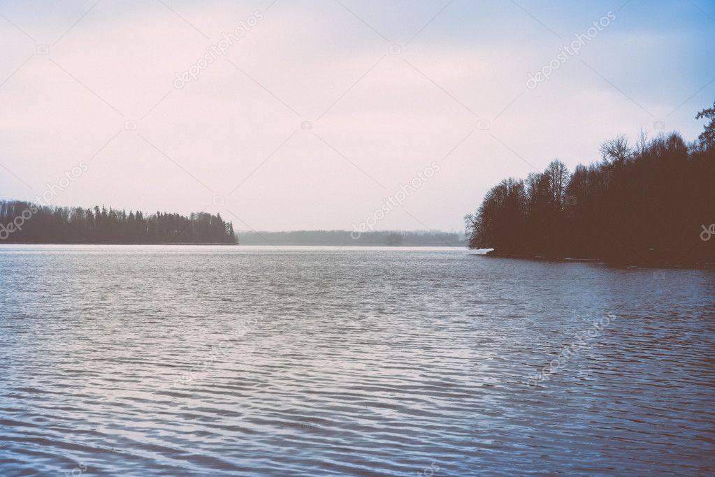 cold winter landscape with frozen river. retro vintage polaroid 