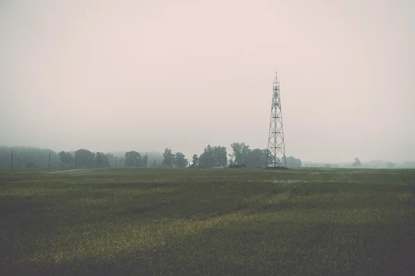 watch tower in the misty field - retro, vintage