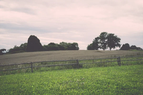 Field with fence in the country - retro, vintage — Stock Photo, Image