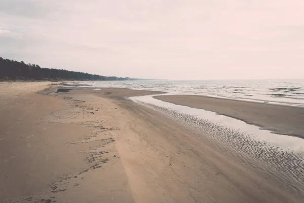 Shoreline of Baltic sea beach with rocks and sand dunes - retro, — Stock Photo, Image
