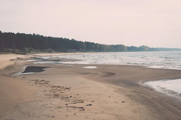 Shoreline of Baltic sea beach with rocks and sand dunes - retro, — Stock Photo, Image