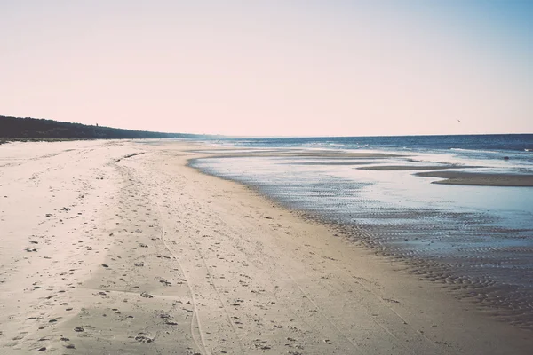 Icy sea beach with first ice pieces - retro, vintage — Stock Photo, Image