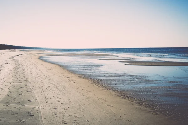 Icy sea beach with first ice pieces - retro, vintage — Stock Photo, Image