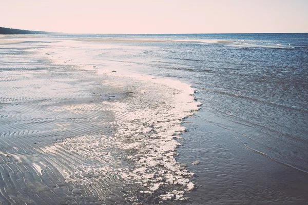 stock image icy sea beach with first ice pieces - retro, vintage