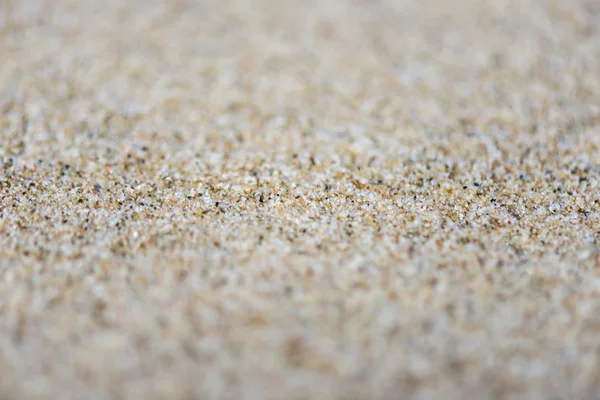 Textura de fundo de areia com profundidade de campo rasa — Fotografia de Stock