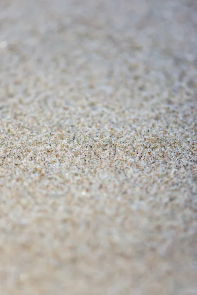 Textura de fundo de areia com profundidade de campo rasa — Fotografia de Stock