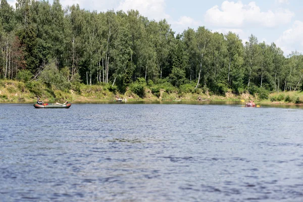 tourists enjoying water sports, kayaking