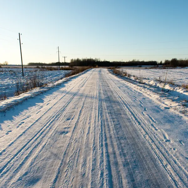 País nevado camino en invierno — Foto de Stock
