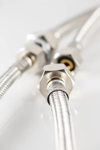 Elastic metal fiber water pipe with connectors — Stock Photo, Image