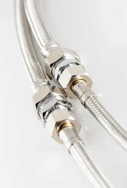 Elastic metal fiber water pipe with connectors — Stock Photo, Image