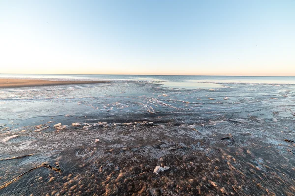 sunset over frozen sea