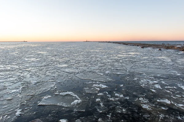 sunset over frozen sea