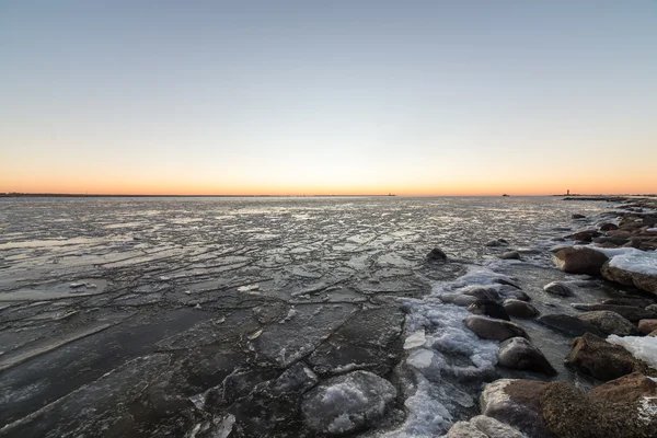 sunset over frozen sea
