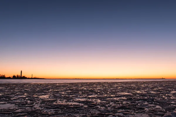 Solnedgång över frusna havet — Stockfoto