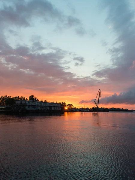 Reddish sunset over port — Stock Photo, Image