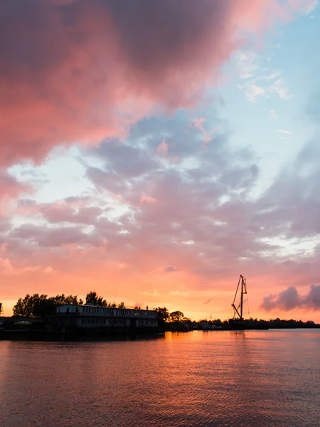 Reddish sunset over port — Stock Photo, Image