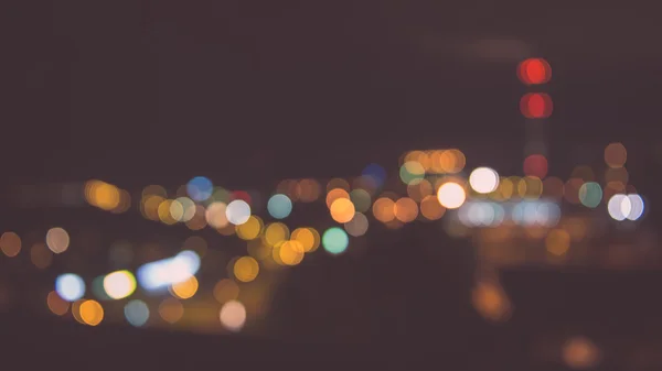 Blurred night lights in city - vintage effect — Stock Photo, Image