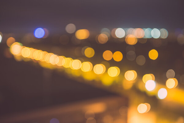 Blurred colored night lights in dark city, festive texture - vintage film effect