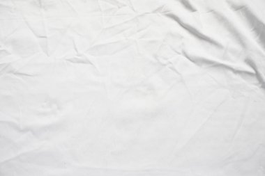 Arkaplan için beyaz buruşuk kumaş kırışıklığı.